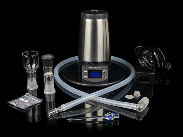 Arizer V-Tower Vaporizer with all accessories around it.