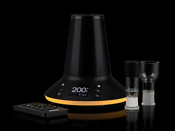 Arizer XQ2 Vaporizer with its glass chambers next to it.