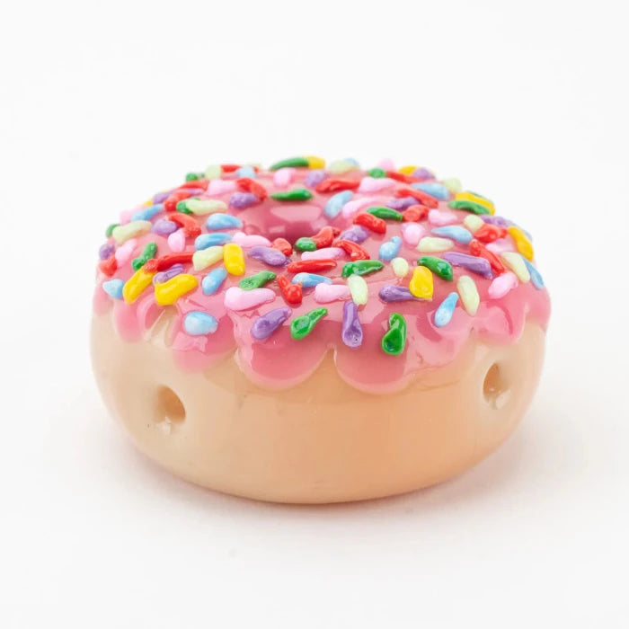 Empire Glassworks Pink Sprinkle Donut Pipe flat with carb hole.
