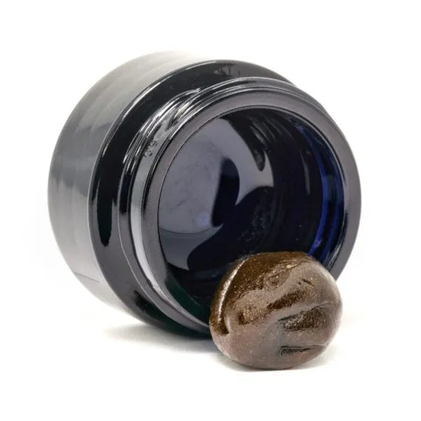 Close-up of Happease CBD Extracts La Crème 28% CBD jar with product visible.
