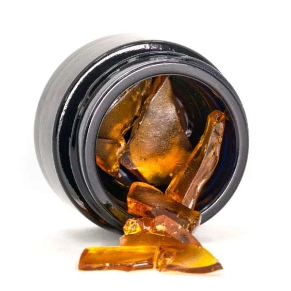 Close-up of Happease CBD Extracts Shatter 58% CBD jar with product visible.