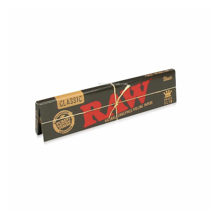 Close-up of Raw Black King Size Slim Rolling Papers pack, standing on