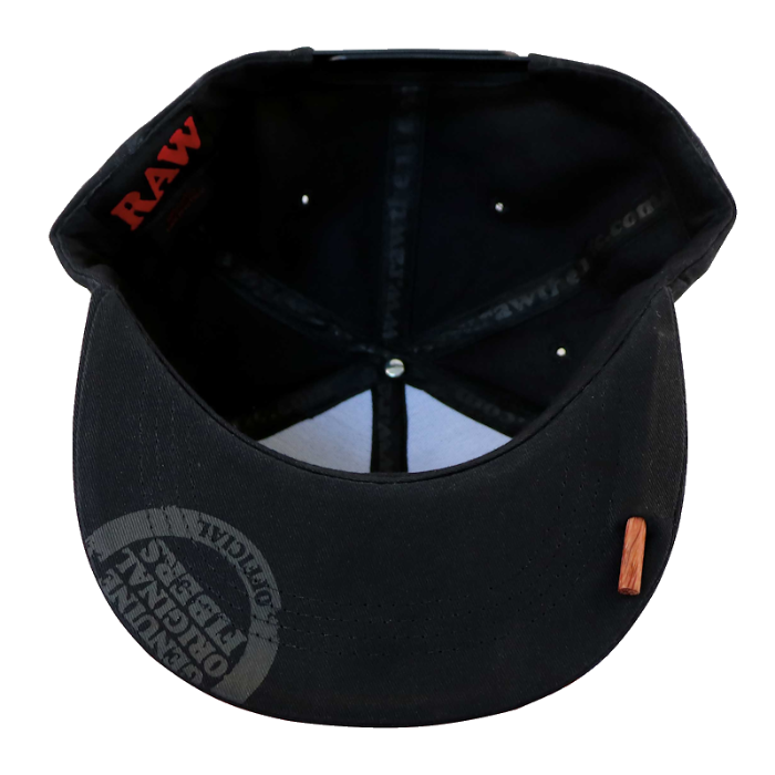 Bottom view of RAW® Flat Bill Snap Back Hat with Black Logo and Poker, showing the poker tool compartment.