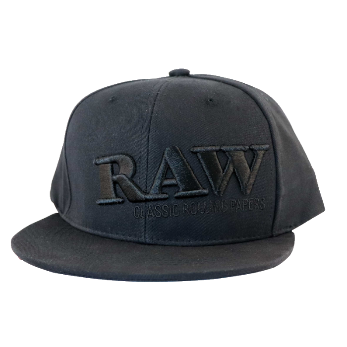 RAW® Flat Bill Snap Back Hat with Black Logo and Poker, resting on a surface.