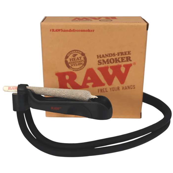 Raw Hands Free Smoker, side view in front of its box, with a rolled cone in use inside the product.
