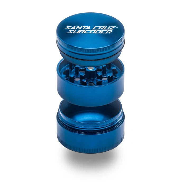 Santa Cruz Shredder® Metal 3 Parts 54mm Blue Grinder, open, posed flat to show interior.