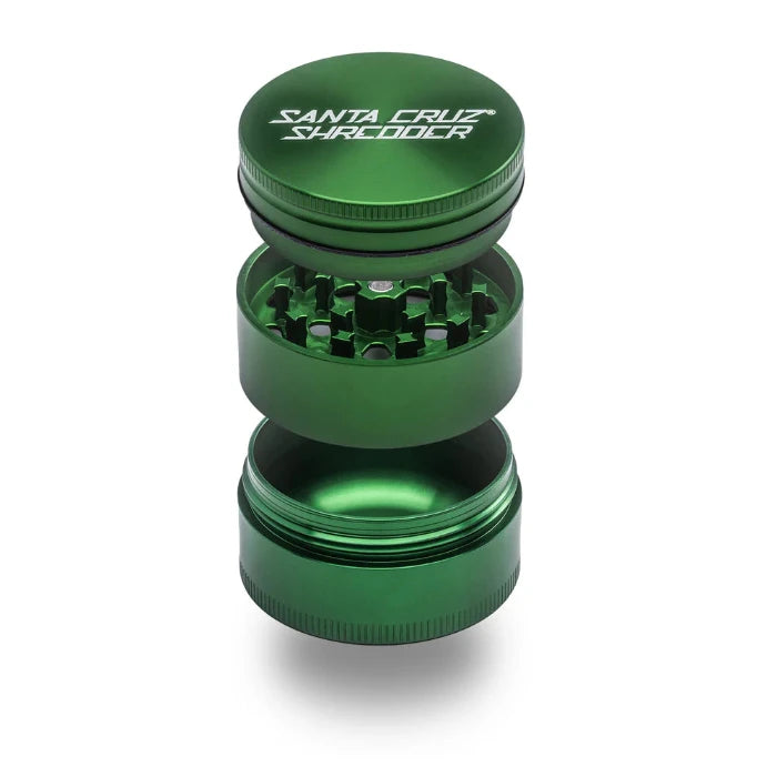 Santa Cruz Shredder® Metal 3 Parts 54mm Green Grinder, open, posed flat to show interior.