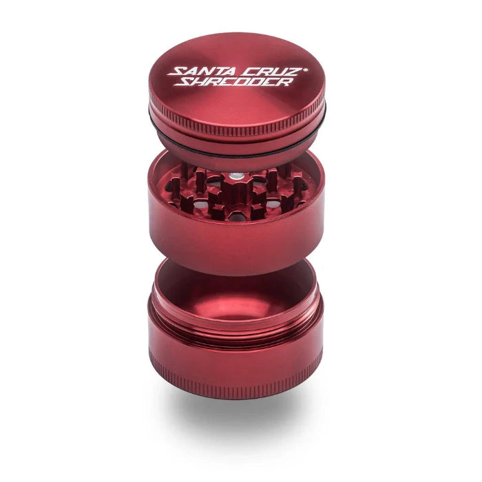 Santa Cruz Shredder® Metal 3 Parts 54mm Red Grinder, open, posed flat to show interior.
