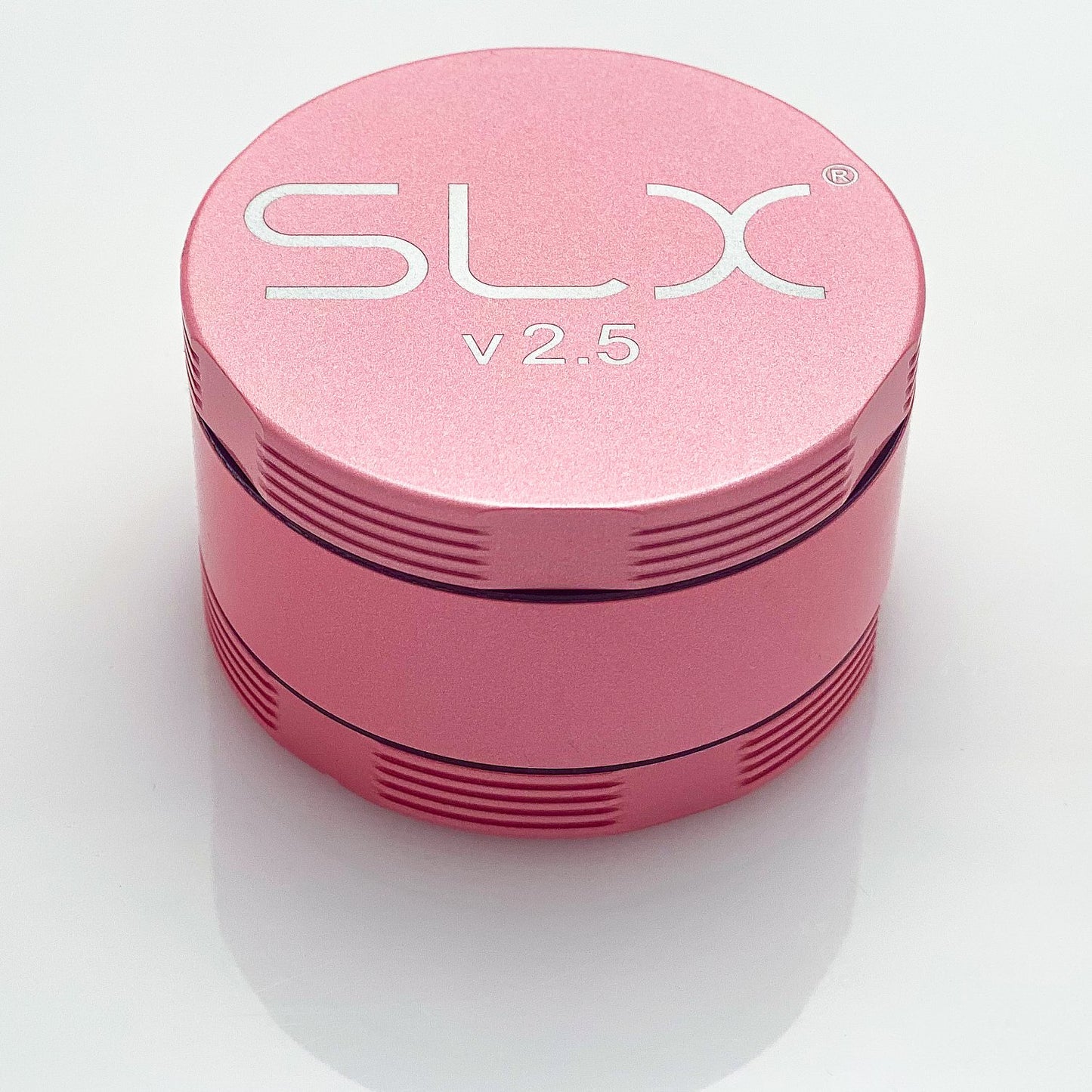 SLX 2.5 Aluminium Non-Sticky Grinder 50 mm Pink standing upright.