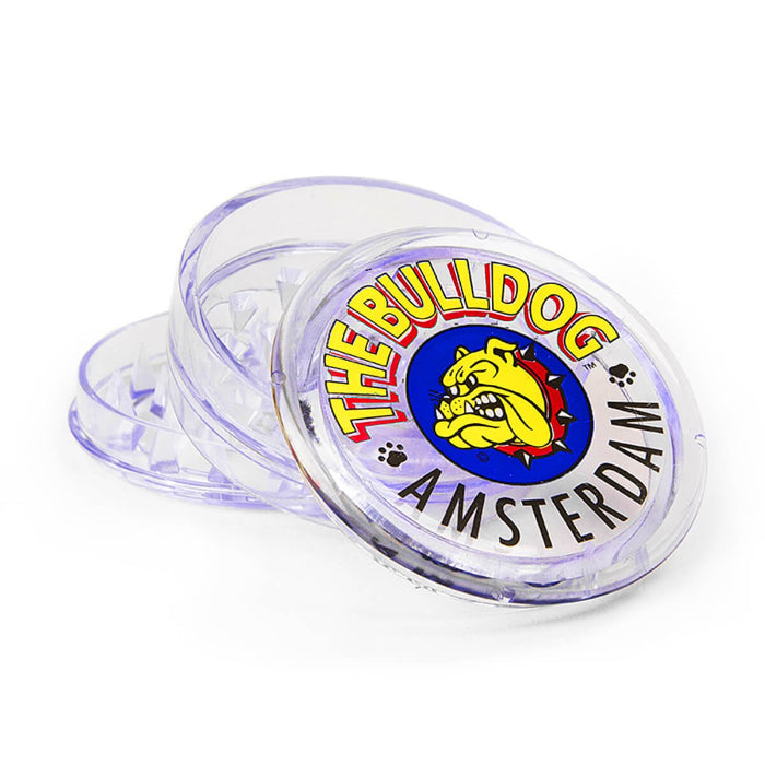 The Bulldog® Original 3 Parts 60mm Transparent Plastic Grinder, open, posed flat to show interior.
