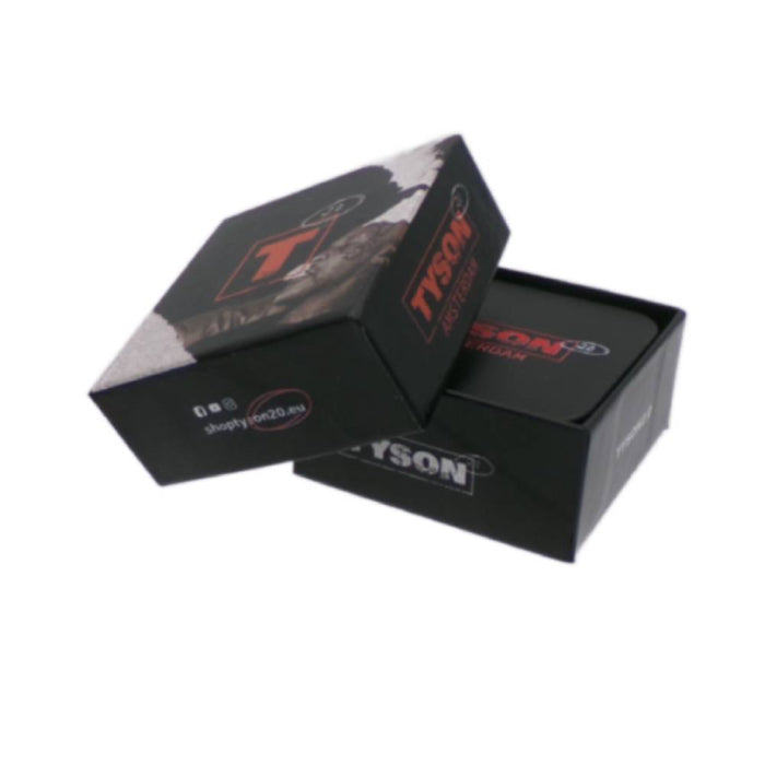 Open box of Tyson 2.0 metal grinder tyson amsterdam 2 parts 54 mm, with grinder inside.