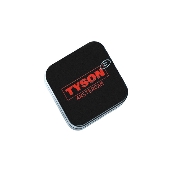 Top-down view of Tyson 2.0 metal grinder tyson amsterdam 2 parts 54 mm, featuring "Tyson Amsterdam" text on the lid.