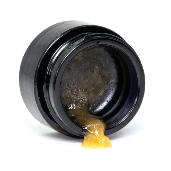 Close-up of Happease CBD Extracts Sugar Wax 62% CBD jar with product visible.