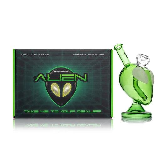 Hemper Alien Bong 6″ with matching illustrated box, featuring a green extraterrestrial glass design.
