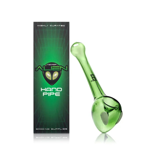 Hemper Alien Handpipe with matching illustrated box, shaped like a green alien head with glossy finish and bold black eyes.