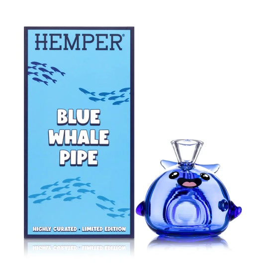 Hemper Blue Whale Hand Pipe with matching illustrated box, shaped like a blue whale with detailed glass fins and tail.
