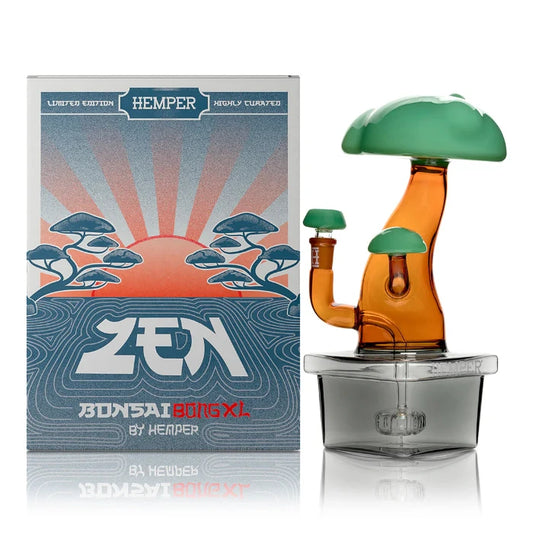 Hemper Bonsai XL Bong 10″ with matching illustrated box, featuring a detailed glass bonsai tree inside a pot-shaped chamber.
