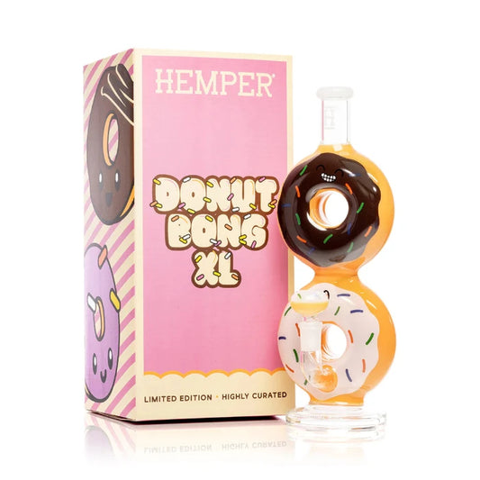 Hemper Donut XL Bong 10″ with matching illustrated box, featuring a playful donut-inspired glass bong with colorful icing and sprinkles design.