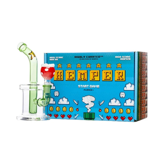 Hemper Gaming Bong 7″ with matching illustrated box, styled like a retro game controller in glass.