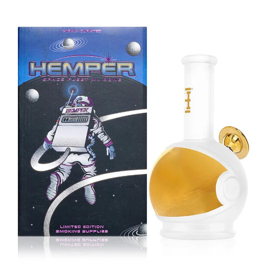 Hemper Space Fleet XL Bong 9″ with matching illustrated box, featuring a spaceship-inspired glass design with futuristic details.