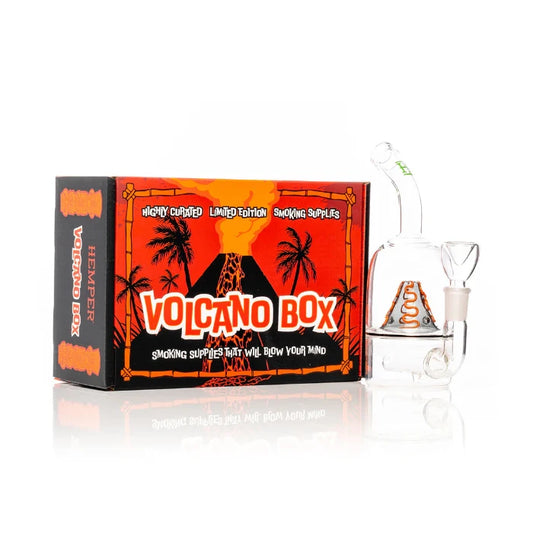 Hemper Volcano Bong 7″ with matching illustrated box, featuring a fiery erupting volcano glass design.