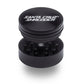 Santa Cruz Shredder® Metal 2 Parts 54mm Black Grinder, open, posed flat to show interior.