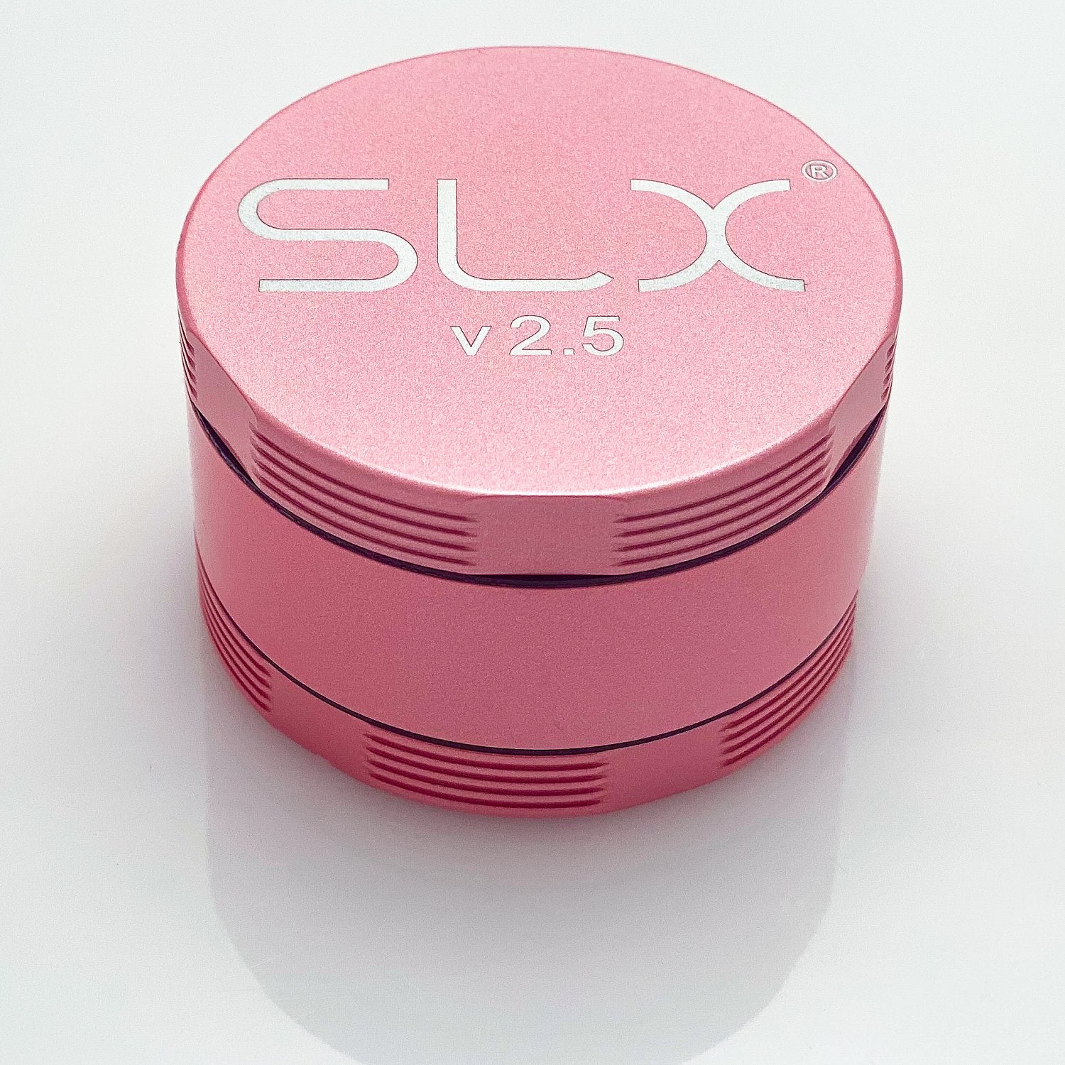 SLX 2.5 Aluminium Non-Sticky Grinder 50 mm Pink standing upright.